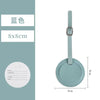 A light mint green PU leather luggage tag with a silver clip and a circular information area.