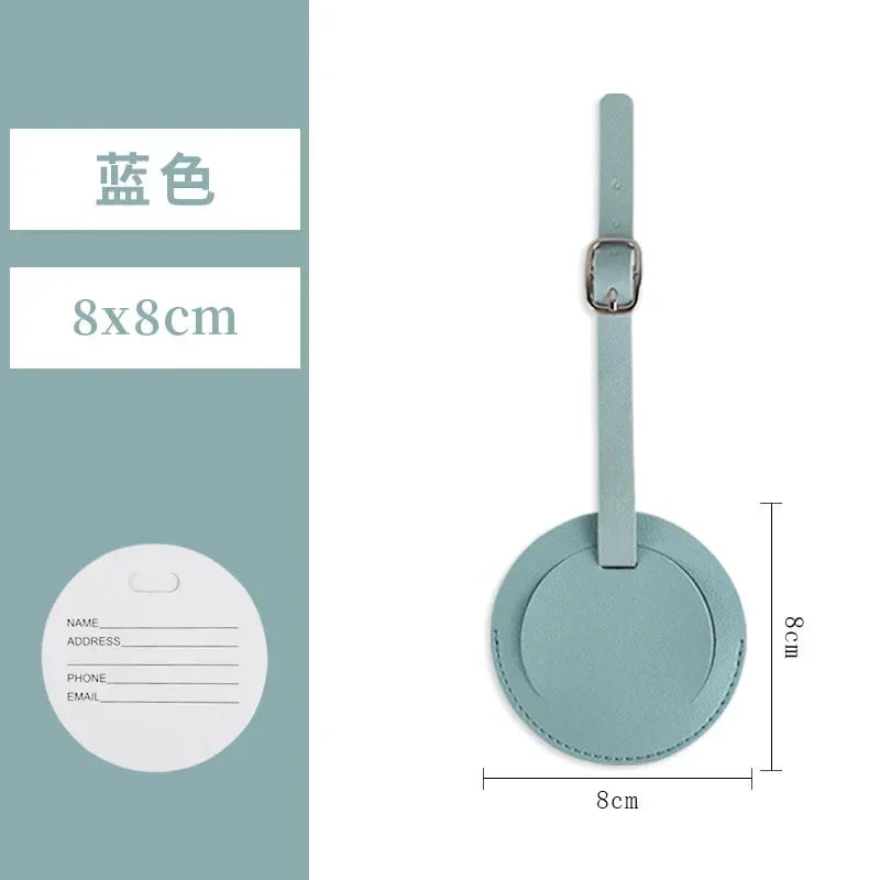 A light mint green PU leather luggage tag with a silver clip and a circular information area.