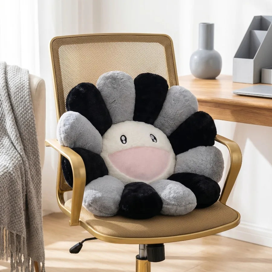 A cheerful sunflower plush cushion with a smiling face is placed on a gold-framed chair.
