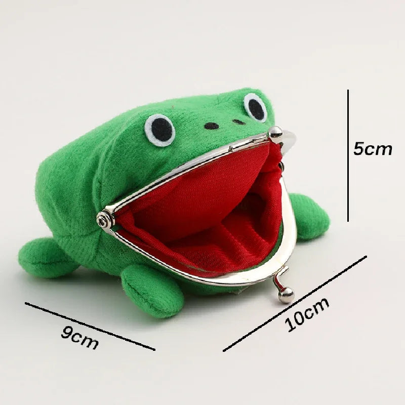 A green plush frog coin purse with a red lining is shown next to a ruler for scale.