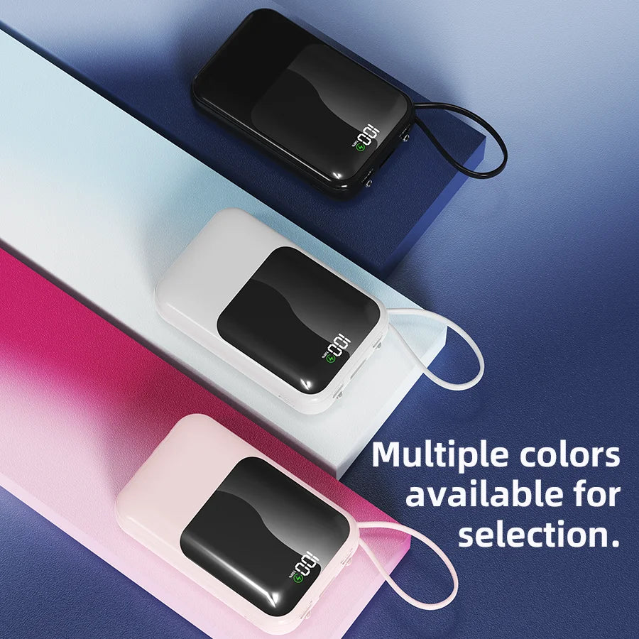 Drei tragbare Powerbanks in schwarz, weiß und pink auf blauem Hintergrund