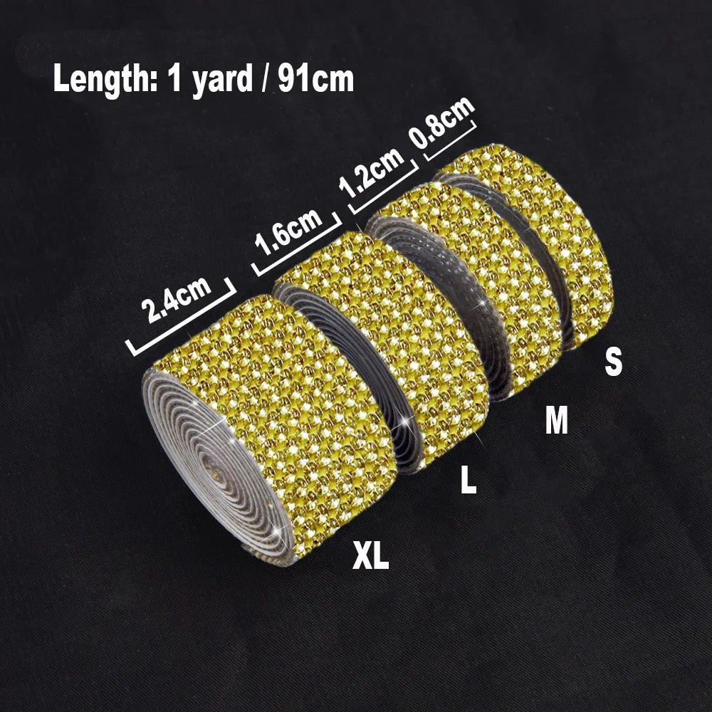 Rolls of gold crystal rhinestone ribbon stickers labeled S, M, L, and XL showing various widths.