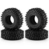 A pair of black mud terrain rubber tires for RC crawlers, shown from the top.