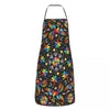 A colorful Mexican floral art apron with a black background featuring vibrant flowers and leaves.
