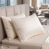 A beige satin striped jacquard duvet cover set displayed on a bed.