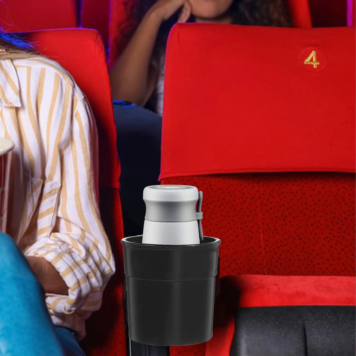 A silver universal chair cup holder is shown in a red office chair setting.