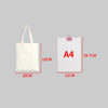 A white canvas shopping tote bag with a foldable design shown next to an A4 sized paper.