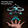 A remote control fighter plane with blue and black accents is shown hovering above a human hand.