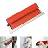 A professional skimming blade with a red body and stainless steel edge is shown being used for wall finishing.