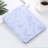 A light purple marble patterned case for an iPad Pro with a built-in pencil holder placed on a white surface.