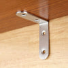 A silver stainless steel 90-degree angle bracket mounted on a wooden surface.