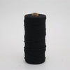 A spool of black macrame cord, 3mm/4mm thickness, used for crafting.