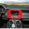 Interior view of a Chevrolet Camaro showing red trim and dashboard components.