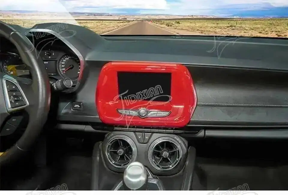 Interior view of a Chevrolet Camaro showing red trim and dashboard components.