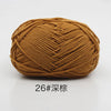 A ball of soft 4-ply milk cotton yarn for knitting and crochet in a warm brown color.