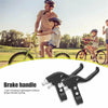 A pair of black brake handles for a bicycle shown next to children riding bikes in an outdoor setting.