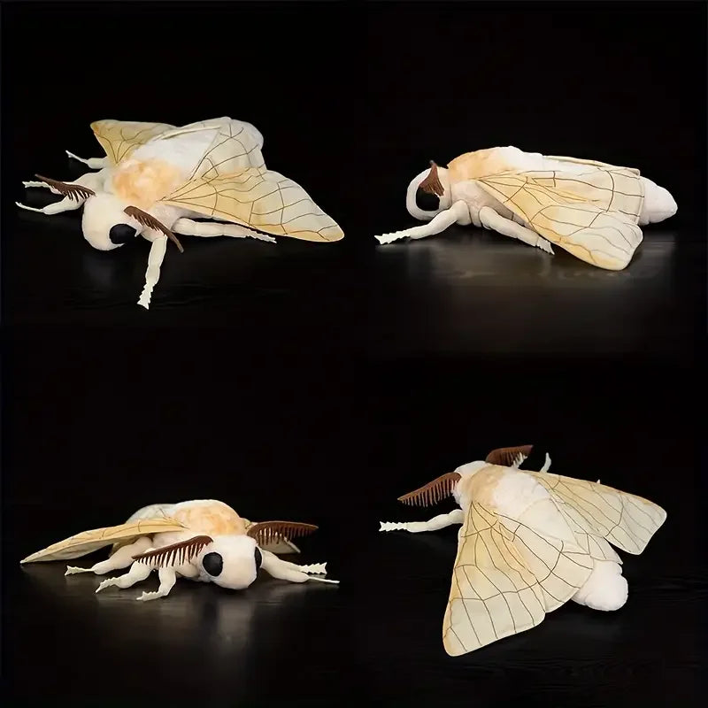 A pair of lifelike Luna moth plush toys with pale yellow wings and white bodies against a black background.