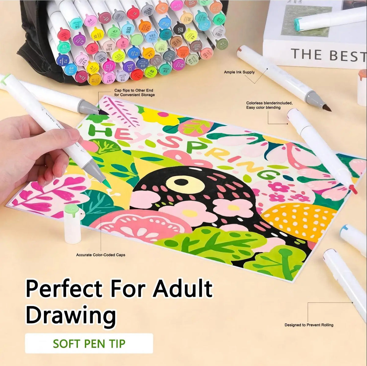 A hand holds a colorful set of dual-tip alcohol art markers for adult drawing and coloring.
