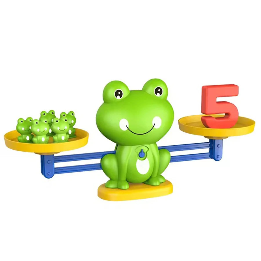 A green frog toy is balanced on a yellow bar, next to a red number 5 block.