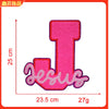 Pink embroidered iron-on patch shaped like the letter T with the word Jesus underneath