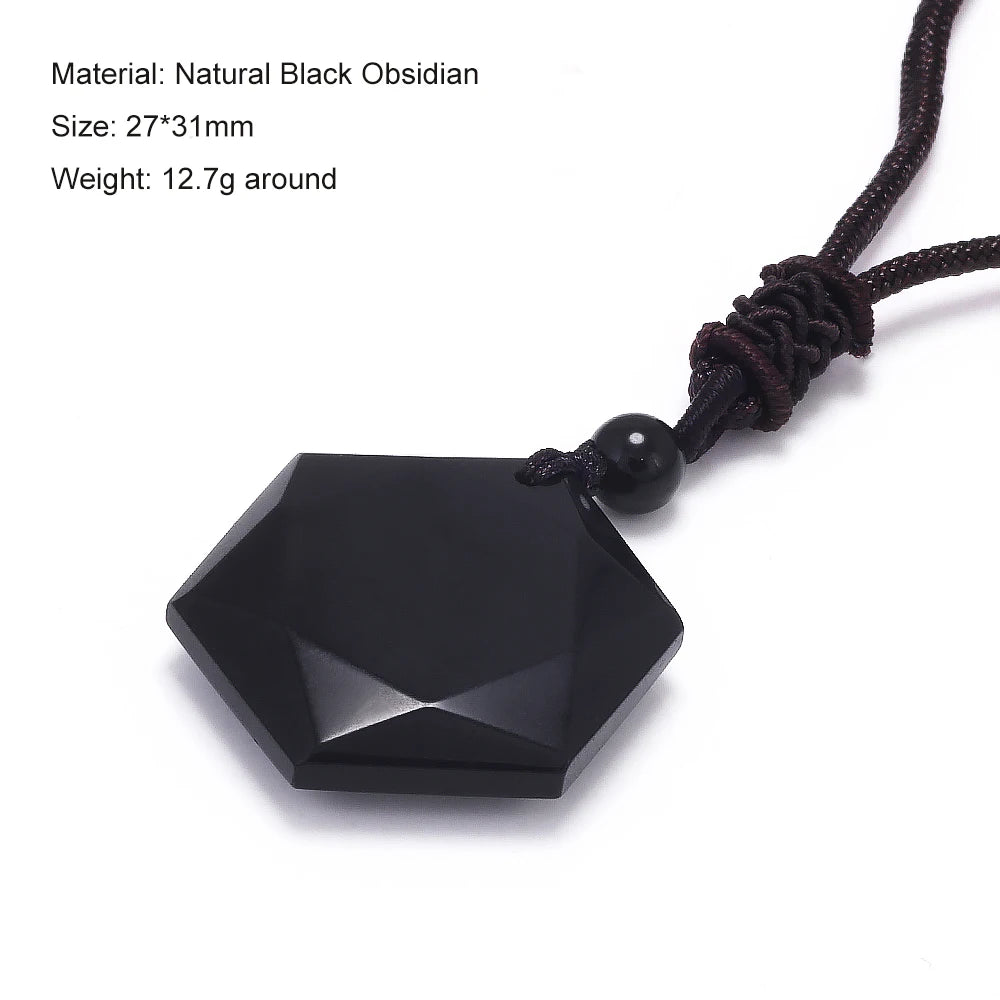 A black hexagonal natural obsidian stone pendant attached to a dark brown leather cord.