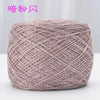 A ball of metallic silver shimmer silk crochet yarn used for knitting and macrame.