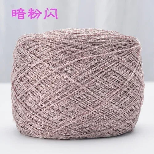 A ball of metallic silver shimmer silk crochet yarn used for knitting and macrame.