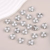 A collection of twenty pearlized resin flower beads for DIY jewelry and crafts.