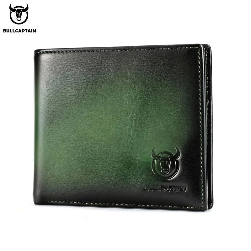 A dark green genuine leather bifold wallet with a silver bull emblem.