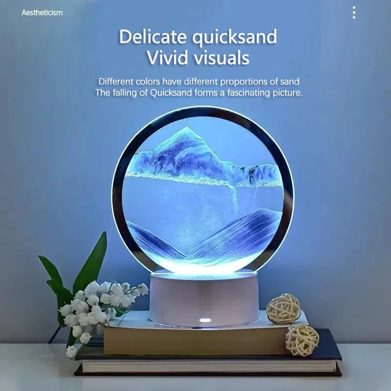 A glass hourglass filled with sand forming a mountain landscape illuminated by a night light.