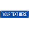A rectangular blue metal sign with white text that reads YOUR TEXT HERE.