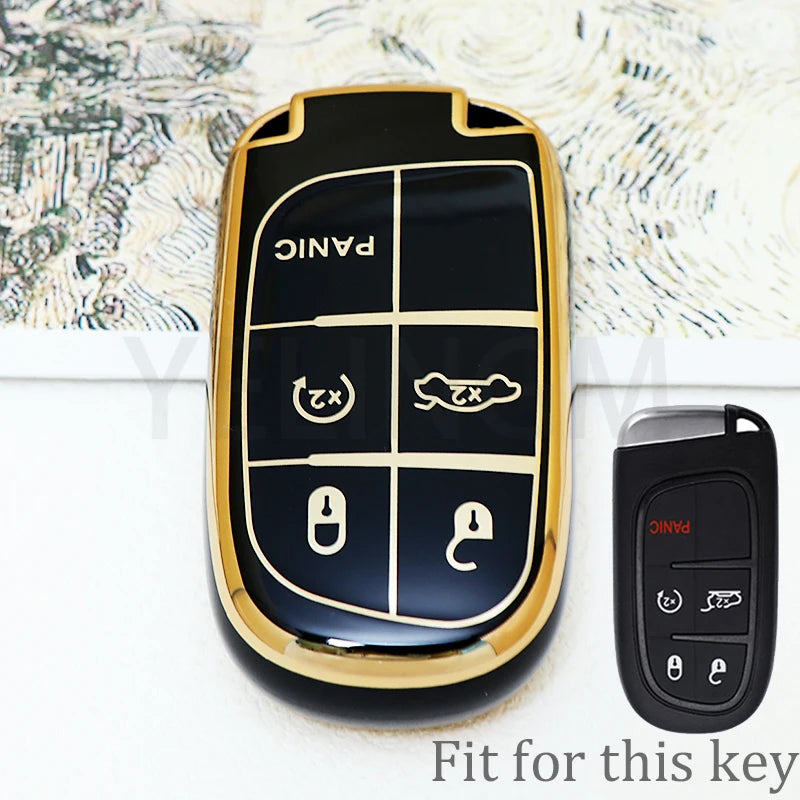 A black and gold durable TPU car key fob cover for a Jeep, Dodge, or Chrysler vehicle.