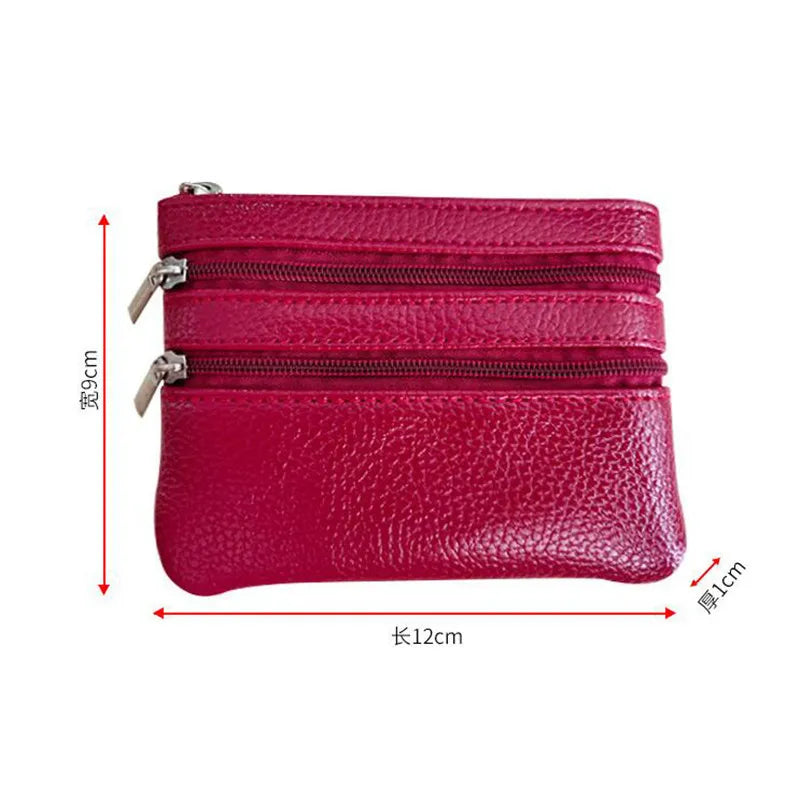 A stack of three magenta PU leather coin purses with zippers shown against a white background.