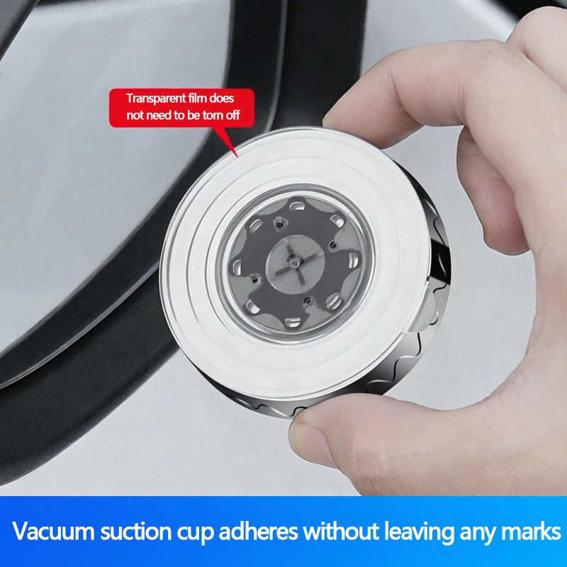 A hand is holding a clear suction cup mirror, demonstrating that the film does not need to be torn off.