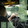 A person is driving a car with an anti-glare sun visor extender installed, showing day and night features.