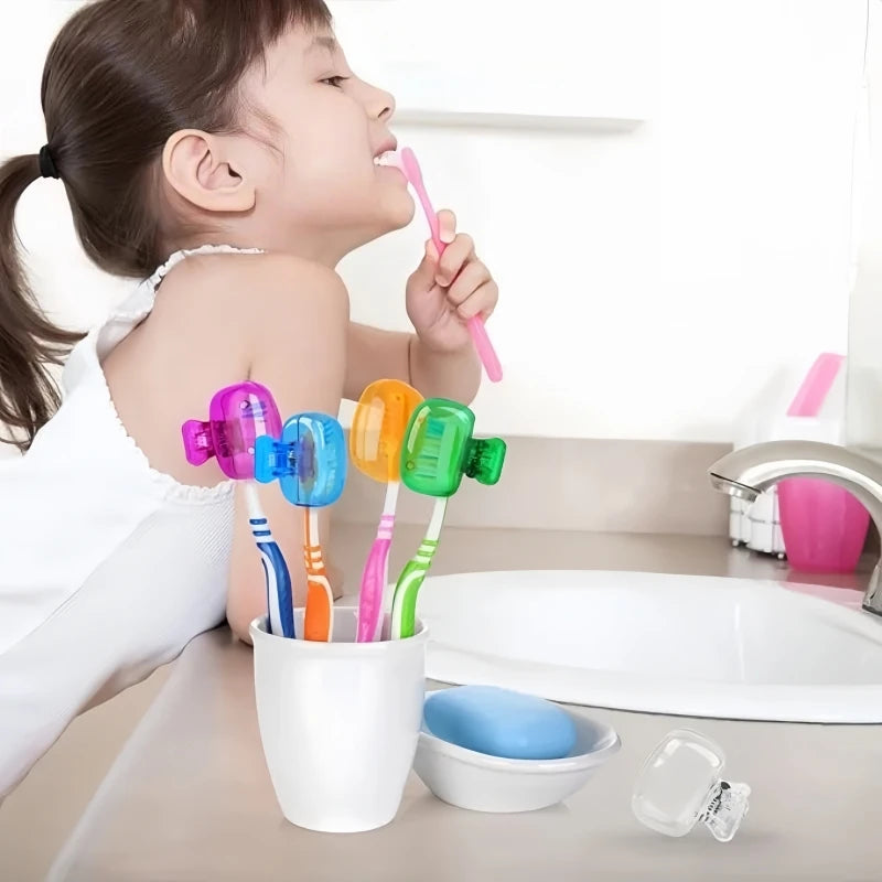A young girl is using a pink toothbrush head cover while brushing her teeth in a white sink.