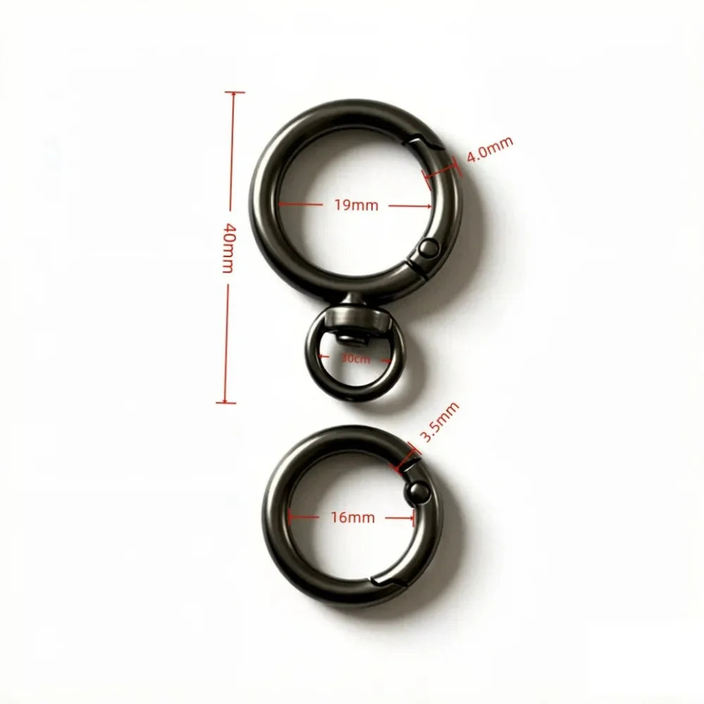 A black round spring snap hook with a swivel design shown against a white background.