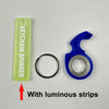A lime green keychain spinner with luminous strips and a blue spinner component.