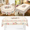 Vintage floral tablecloth featuring pink and blue roses and greenery for a dining table.