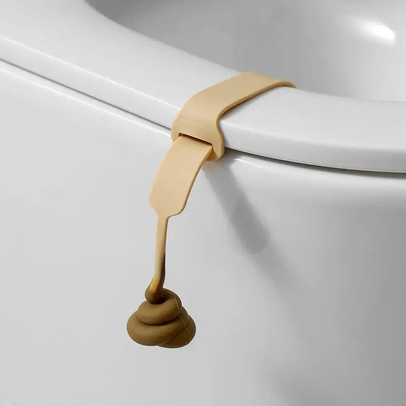 A beige hands-free toilet lid lifter is shown attached to a white porcelain toilet rim.