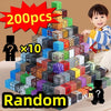A child is holding a large tower of colorful magnetic building blocks with a random assortment, labeled 200 pieces.