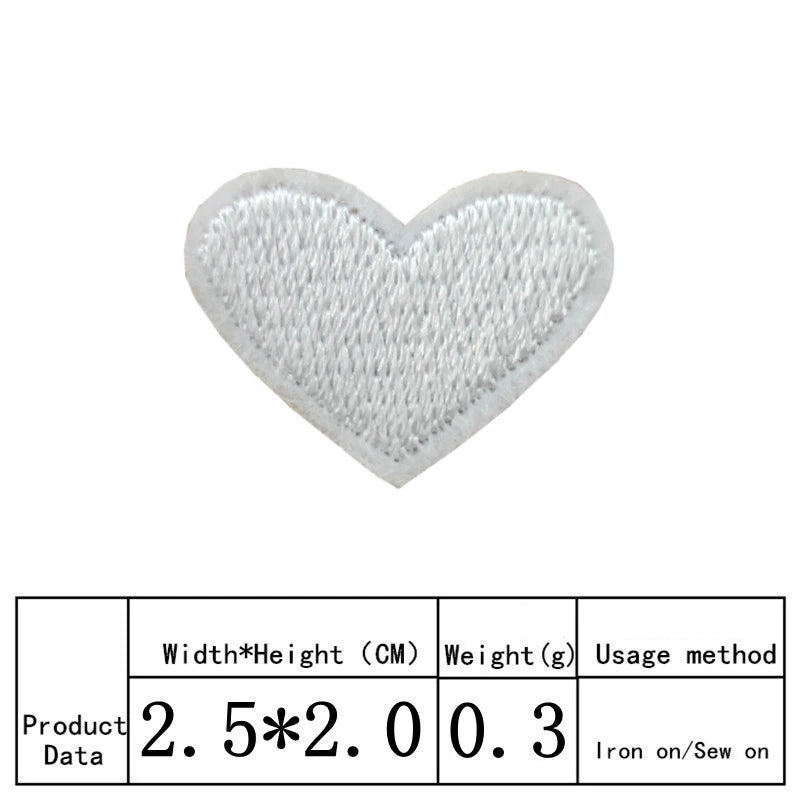 A white heart shaped embroidered iron-on patch with a textured surface.