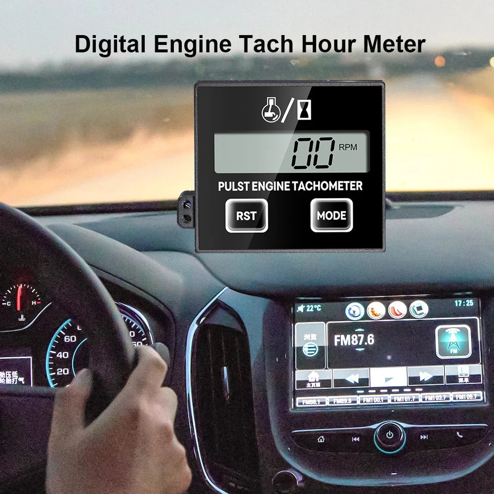 A digital engine tachometer and hour meter display showing 00 RPM, mounted in a car dashboard.