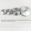 A row of polished stainless steel ceiling mount canopy discs of various sizes are displayed.
