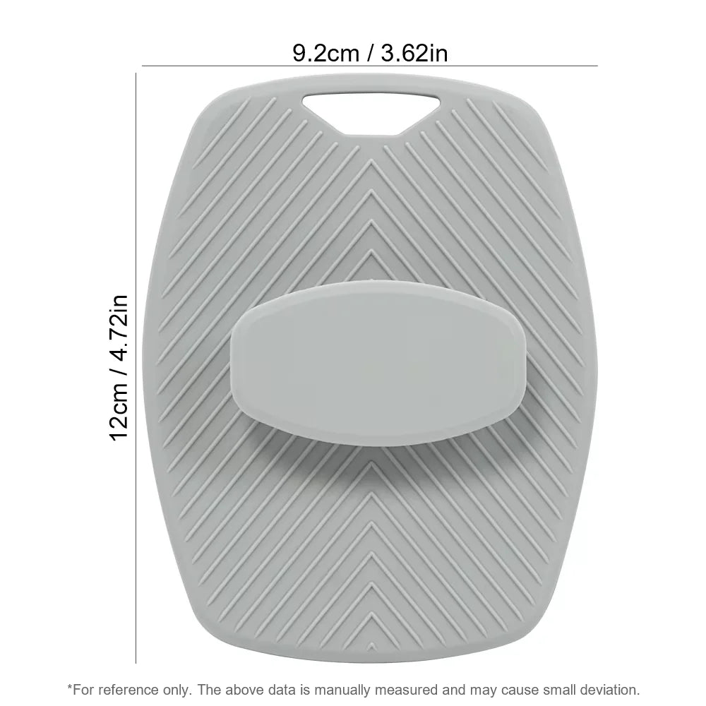 A gray silicone body scrubber and massage brush with a contoured shape.