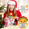 A young woman in a red sweater holds a handmade crochet taco plush toy with a festive Christmas theme.