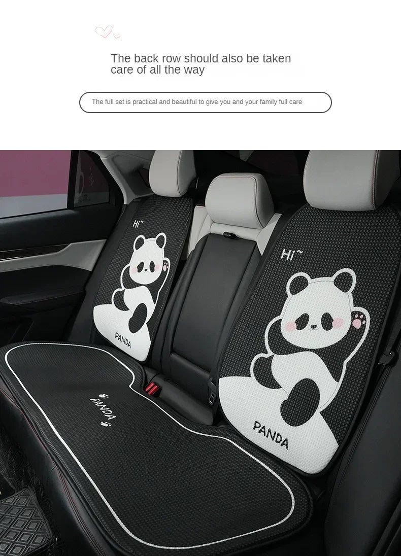 Black car seat covers with white panda headrest pillows installed in a vehicle interior.