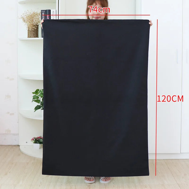 A person demonstrates the size of an extra large heavy-duty canvas laundry bag, showing a height of 74cm and a length of 120c