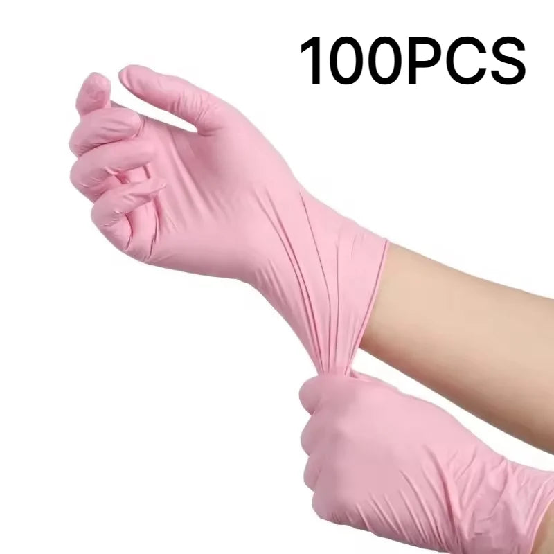 A hand wearing a pink disposable nitrile glove is shown, with the text 100PCS visible in the background.