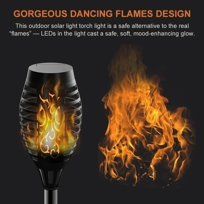 A black solar torch light emitting a soft, warm, flame-like glow against a dark background.